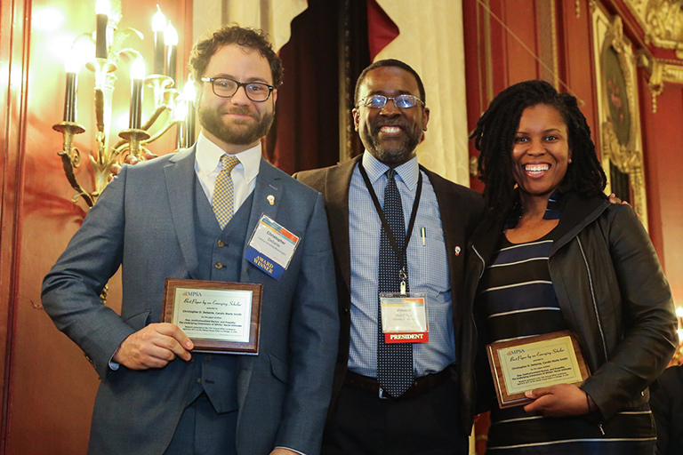 Three people posing for a photo, two of which are DeSante Award winners