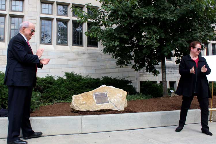 IU President Michael A. McRobbie and Provost Lauren Robel reveal the Ostrom memorial on the Southside of Woodburn Hall.