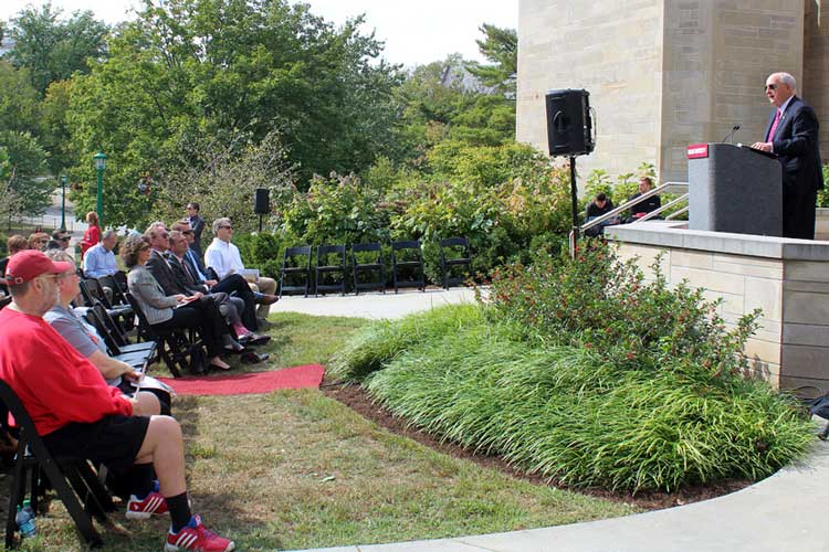 IU President Michael A. McRobbie speaking to a crown on the Southside of Woodburn Hall during the Ostrom event,.